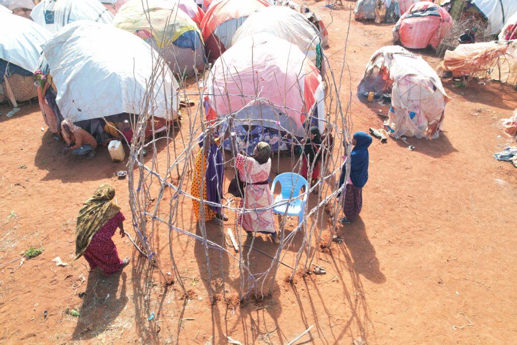 Women building a traditional ‘Buul’ shelter in Somalia.